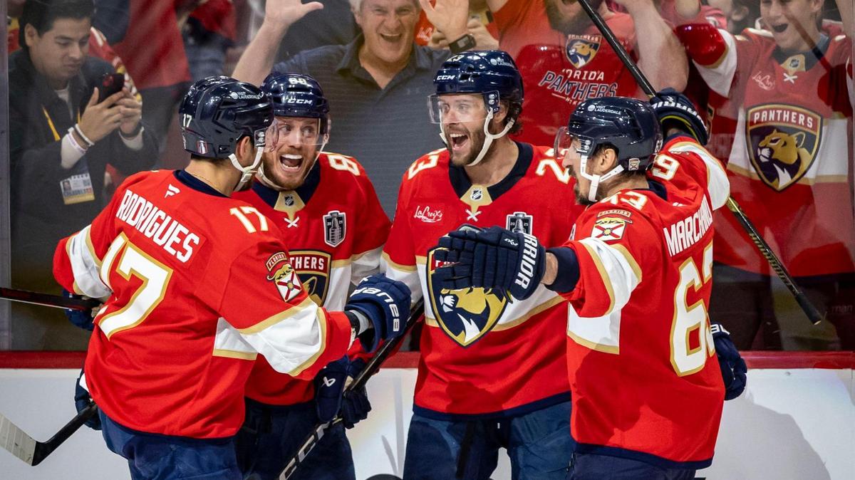 Florida’s Carter Verhaeghe, center, is congratulated by teammates after scoring to make the score 2-0 in favor of the Panthers during the first period of Game 3 in the NHL Stanley Cup Final series at Amerant Bank Arena on Monday, June 9, 2025, in Sunrise, Fla.