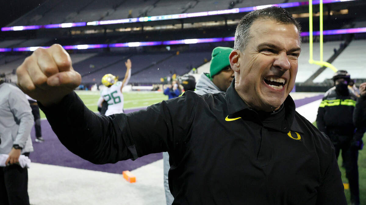 Head coach Mario Cristobal of the Oregon Ducks celebrates after beating Washington Huskies 26-16 at Husky Stadium on November 06, 2021 in Seattle, Washington.