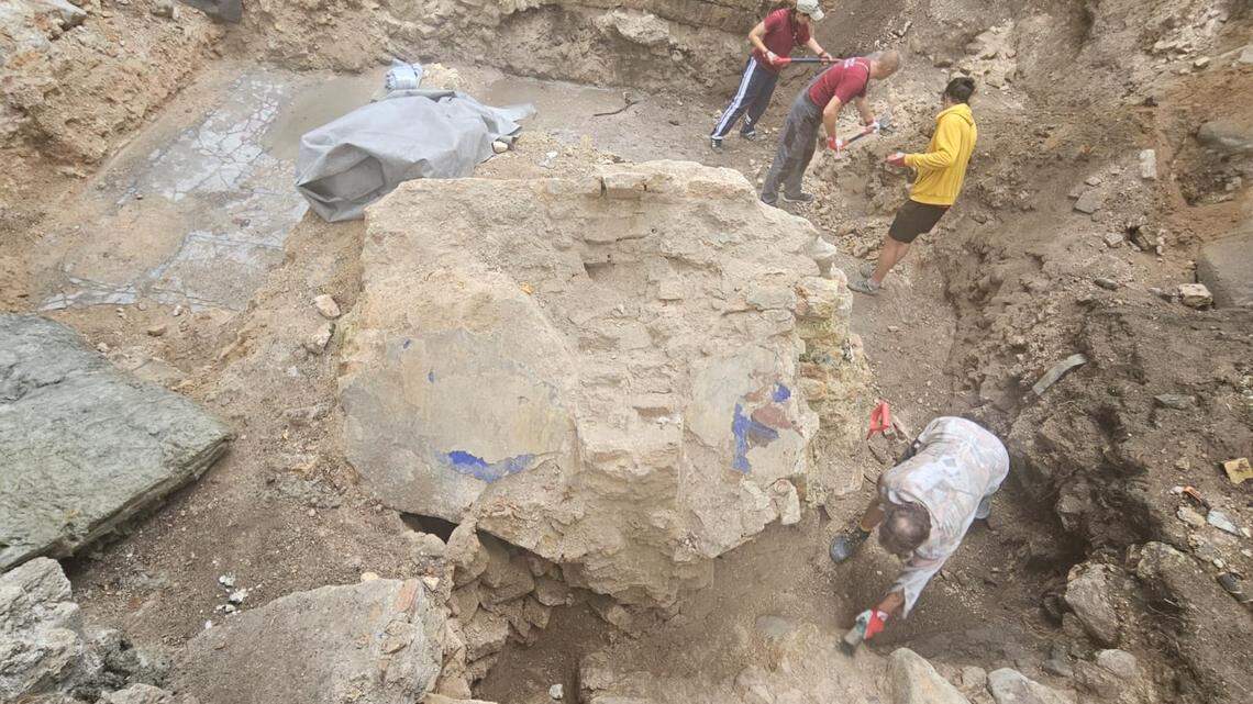 Colors on pieces of the floor and wall show it was once decoratively painted, officials said.