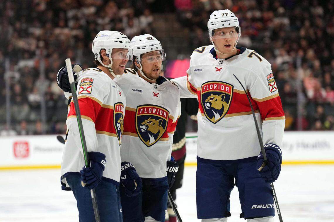 Jan 2, 2024; Tempe, Arizona, USA; Florida Panthers center Carter Verhaeghe (23) celebrates his goal with Florida Panthers defenseman Brandon Montour (62) and Florida Panthers defenseman Niko Mikkola (77) against the Arizona Coyotes during the first period at Mullett Arena.