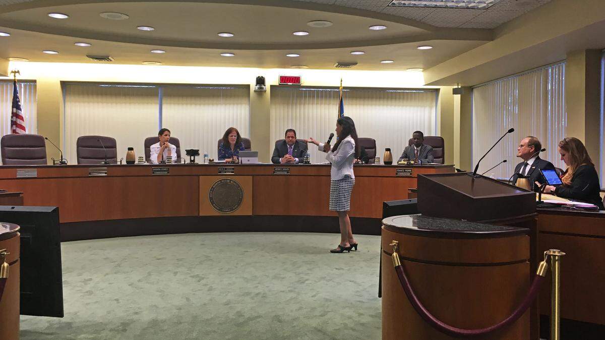 Interim mayor Beth Spiegel, center, listens to Fortuna Smukler's acceptance speech after she was appointed to fill one of the two vacant seats on the commission at an emergency meeting on May 10, 2018.