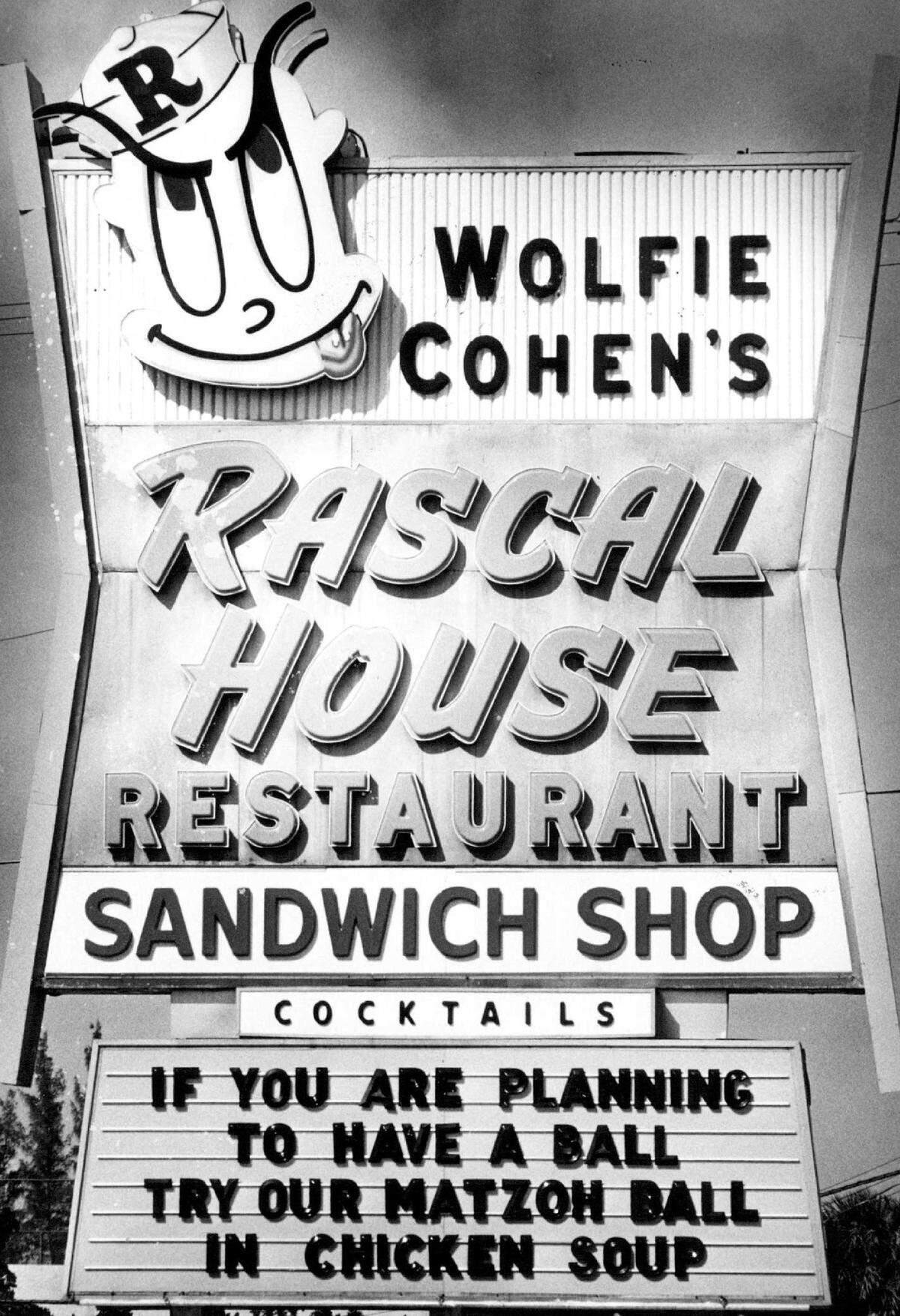 The sign and in front of Rascal House.