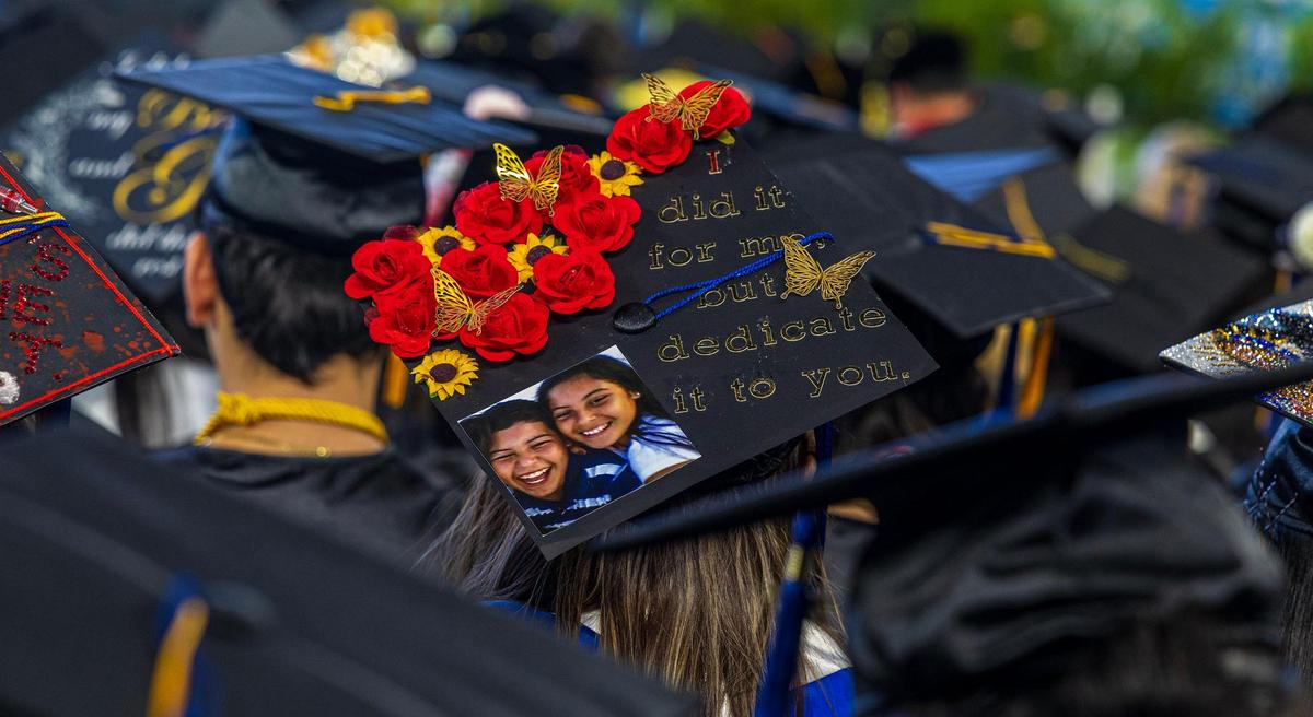 Messages seen on graduating students’ mortarboards during Miami Dade College’s North, Hialeah and West Campuses 2025 commencement ceremonies at LoanDepot Park, in Miami on Saturday, April 26, 2025.