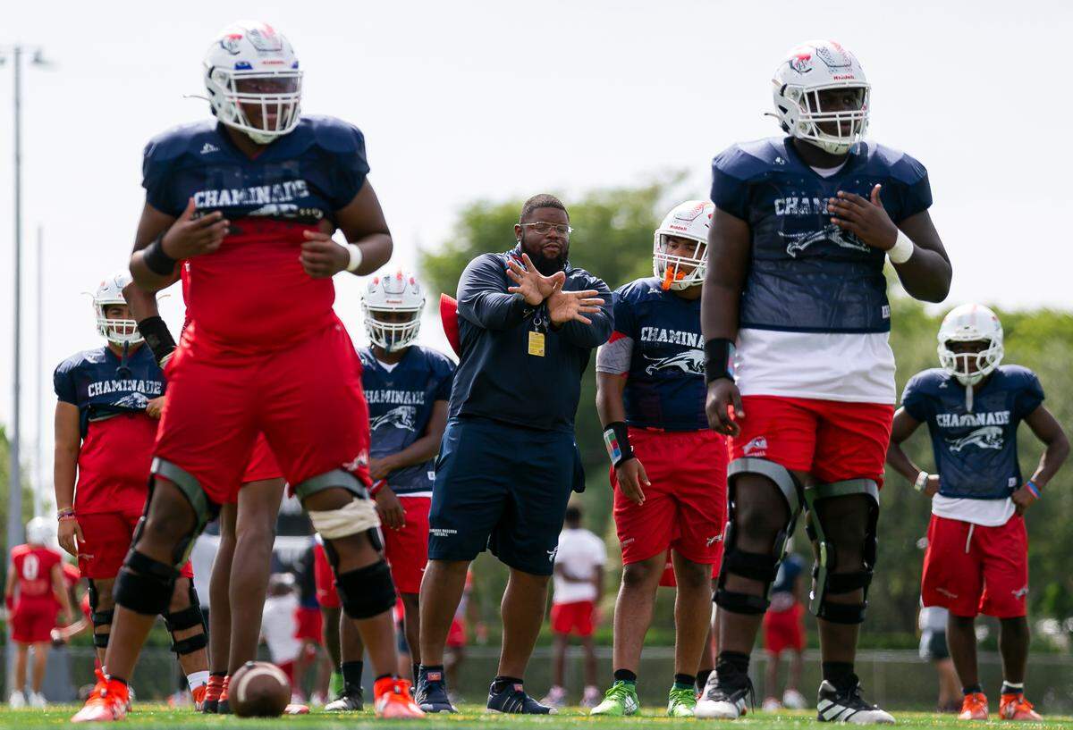 Chaminade-Madonna players run drills during a football practice at their school’s field in Hollywood, Florida on Wednesday, August 25, 2021.