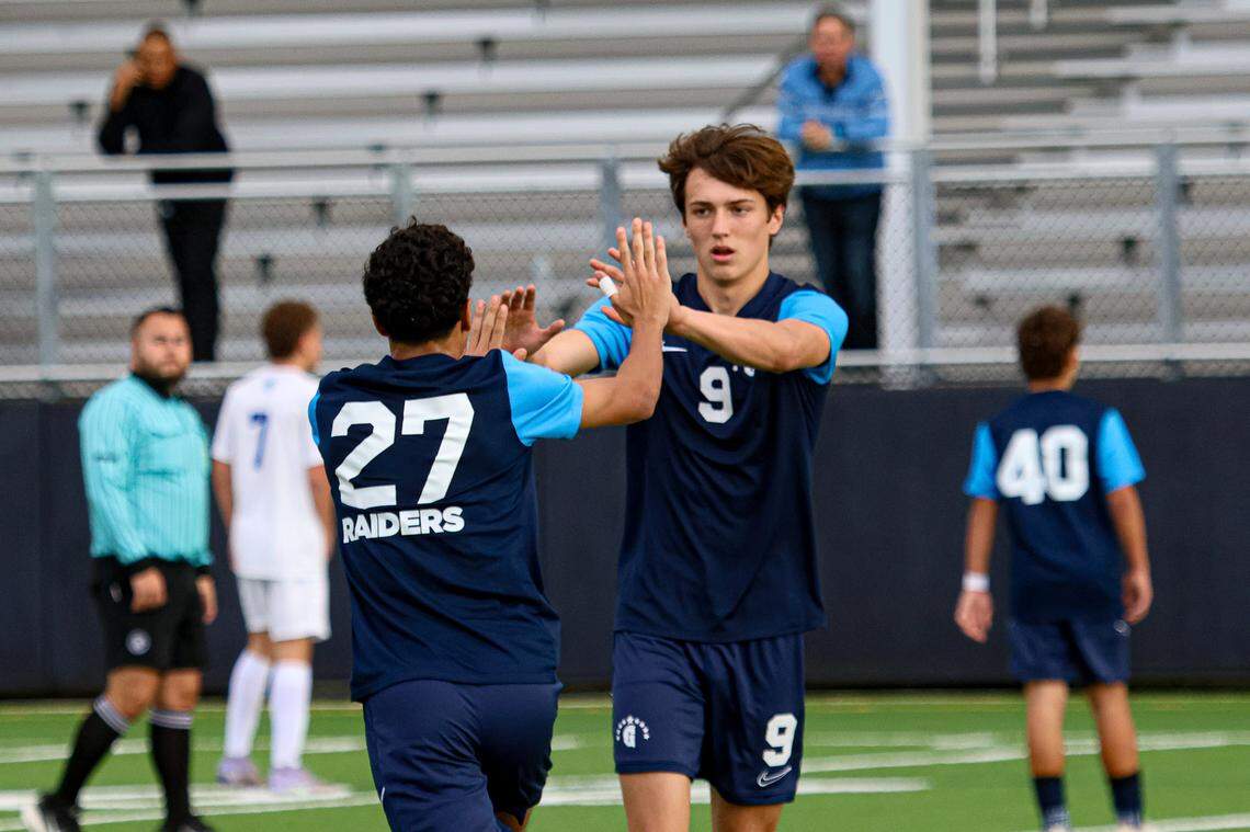Gulliver’s Marco Balestrazzi (right) high-fives teammate Youssef El Zomor (left) during Tuesday’s Region 4-3A boys’ soccer quarterfinal win over JC Bermudez.