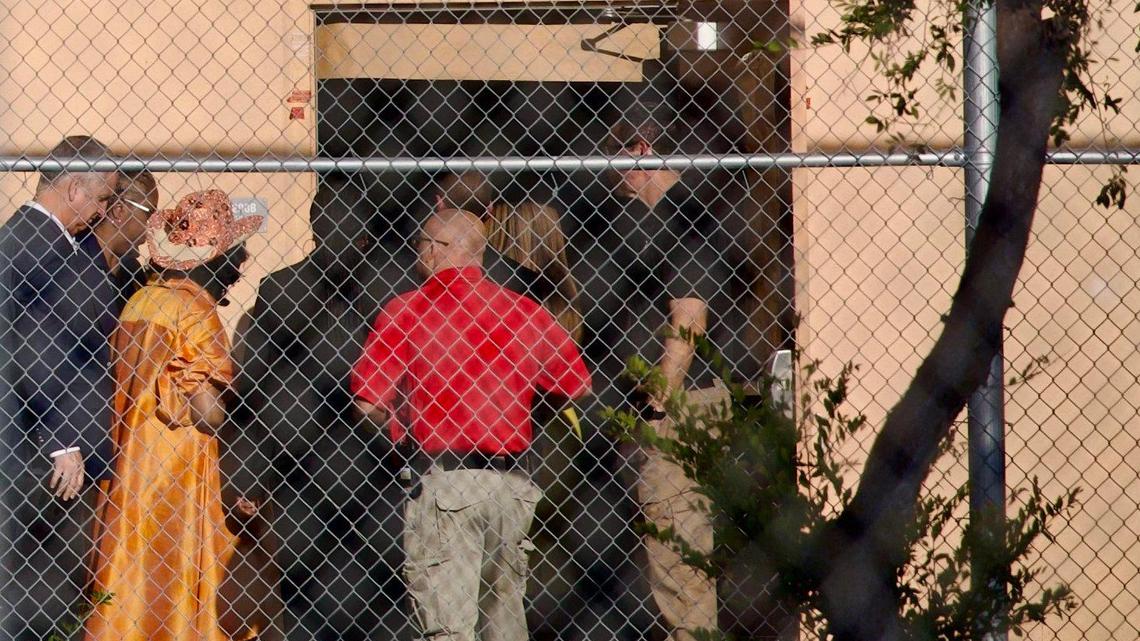 U.S. Reps. Mario Diaz-Balart, far left, and Frederica Wilson, third from left, enter Marjory Stoneman Douglas High School in Parkland, Florida, during a visit with other members of Congress on Aug. 4, 2023.