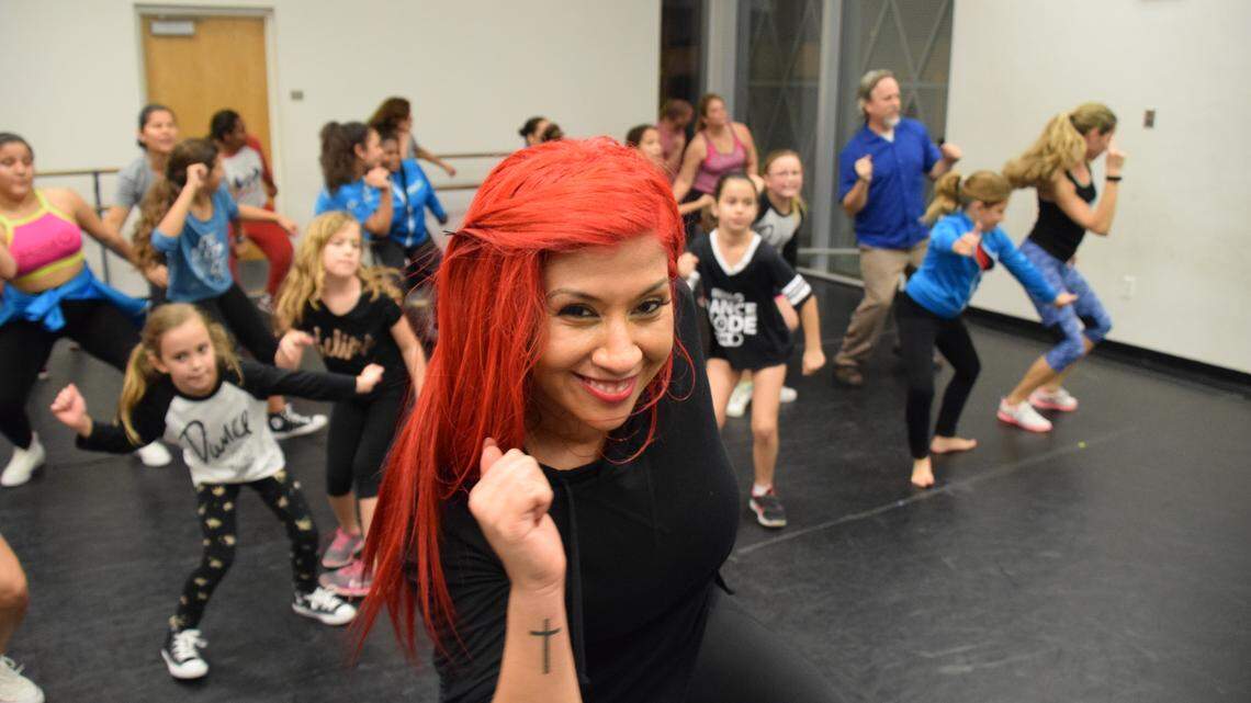 Dance director Mady Richmond leads a class at Mady’s Dance Factory in Miami. She co-founded the nonprofit One Heart Foundation, which helps offer dance lessons to those who can’t afford it. Dancing helped Richmond overcome personal obstacles, and she is motivating children through dance.