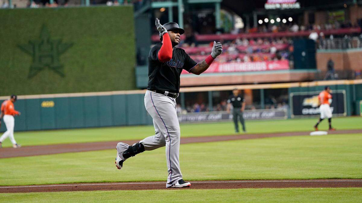 Miami Marlins’ Jesus Aguilar celebrates after hitting a home run against the Houston Astros during the first inning of a baseball game Friday, June 10, 2022, in Houston.