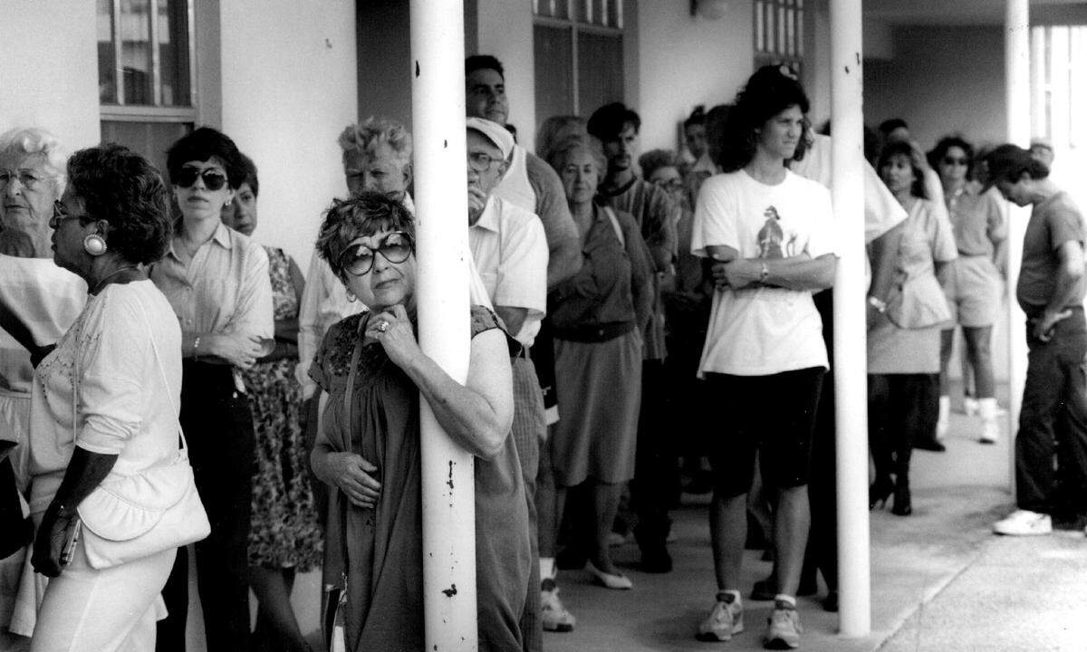 Voters wait to cast their ballots in Miami in 1992.