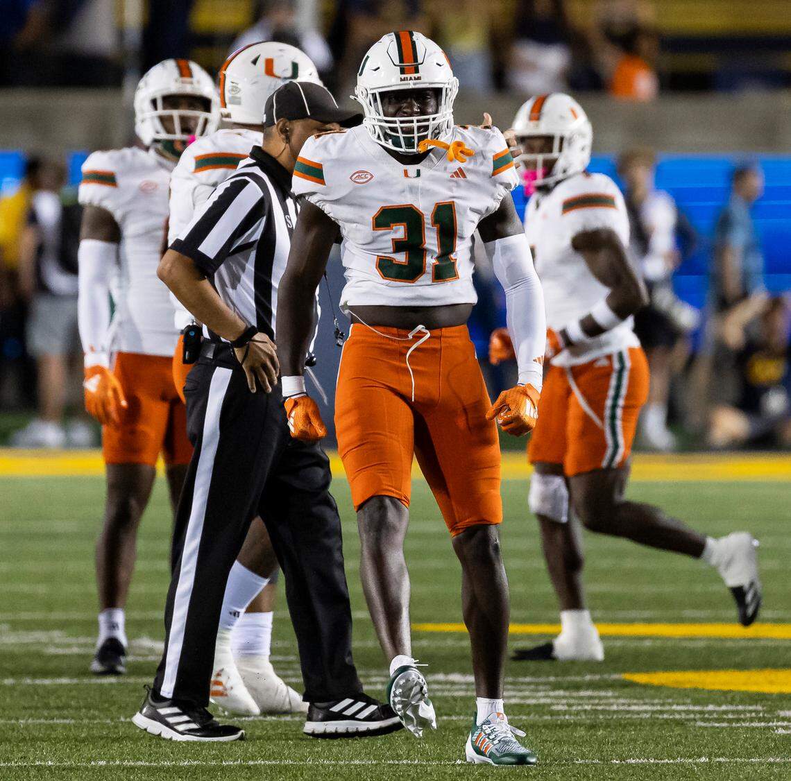 Miami Hurricanes linebacker Wesley Bissainthe (31) reacts after tackling California Golden Bears quarterback Fernando Mendoza (15) in the second half of their NCAA college football game at the California Memorial Stadium on Saturday, Oct. 5, 2024, in Berkeley, Calif.