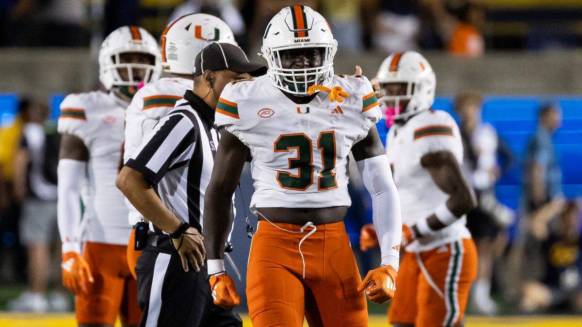 Miami Hurricanes linebacker Wesley Bissainthe (31) reacts after tackling California Golden Bears quarterback Fernando Mendoza (15) in the second half of their NCAA college football game at the California Memorial Stadium on Saturday, Oct. 5, 2024, in Berkeley, Calif.