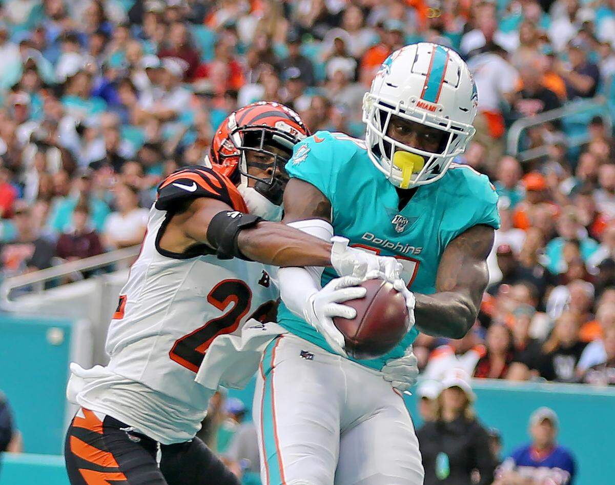 Miami Dolphins wide receiver DeVante Parker (11) catches a first quarter touchdown as Cincinnati Bengals Williams Jackson fails to defend at Hard Rock Stadium in Miami Gardens, Florida, Sunday, December, 22, 2019.
