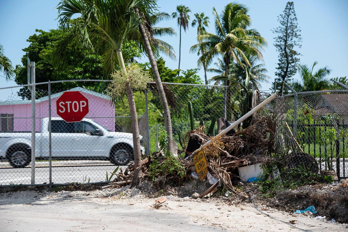 A pile of debris sits in the back corner of the section of Miami Soar mobile home park formerly known as Trinidad Court on June 23, 2019.