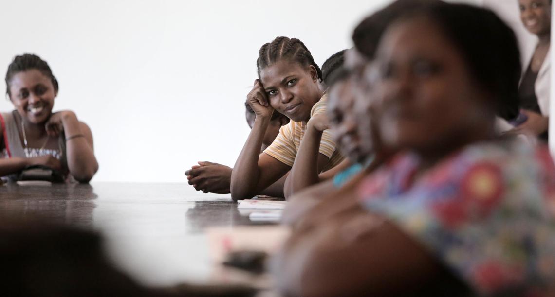 Female factory workers at Cleveland Manufacturing in Port-au-Prince listen to midwife Nanotte Louis as she urges them to get screened for cervical cancer.  Louis’ employer, Innovating Health International, launched the factory “see-and-treat” program in October 2017 along with Share Hope Haiti.