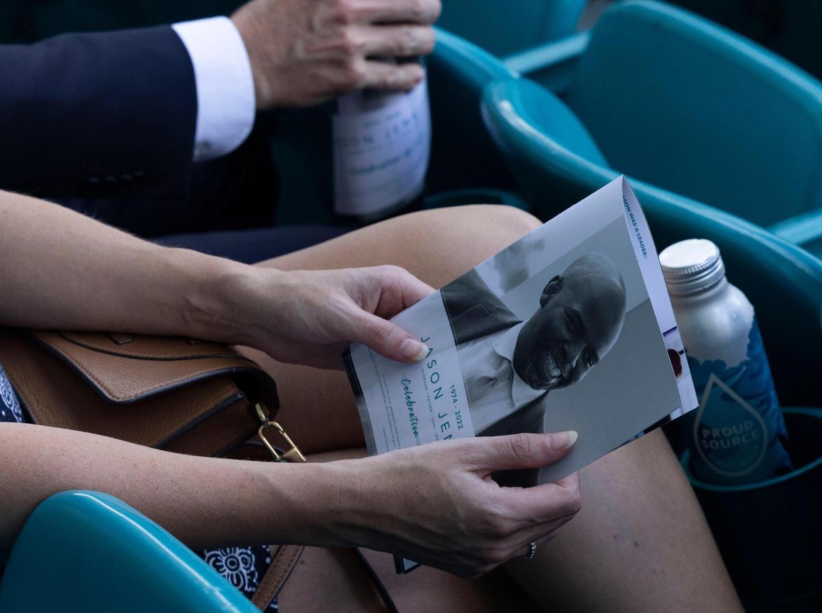 A woman holds a program before Jason Jenkins Celebration of Life on Monday, Sept. 5, 2022, at the Hard Rock Stadium in Miami Gardens. Jenkins was the Senior Vice President of Communications and Community Affairs for the Miami Dolphins.