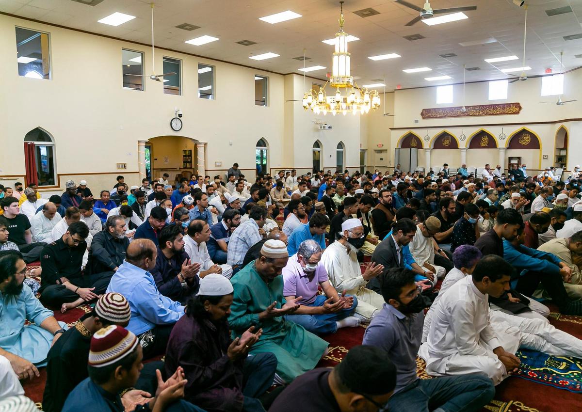 People perform the Eid al-Adha prayer at the Islamic Center of Greater Miami on Saturday, July 9, 2022, in Miami Gardens, Fla.