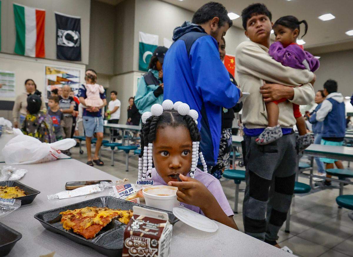 Evacuee Mirakle Storey, 5, eats soup during lunch in a hurricane shelter at Brookside Middle School in Sarasota, Florida on Wednesday, Oct. 9, 2024.