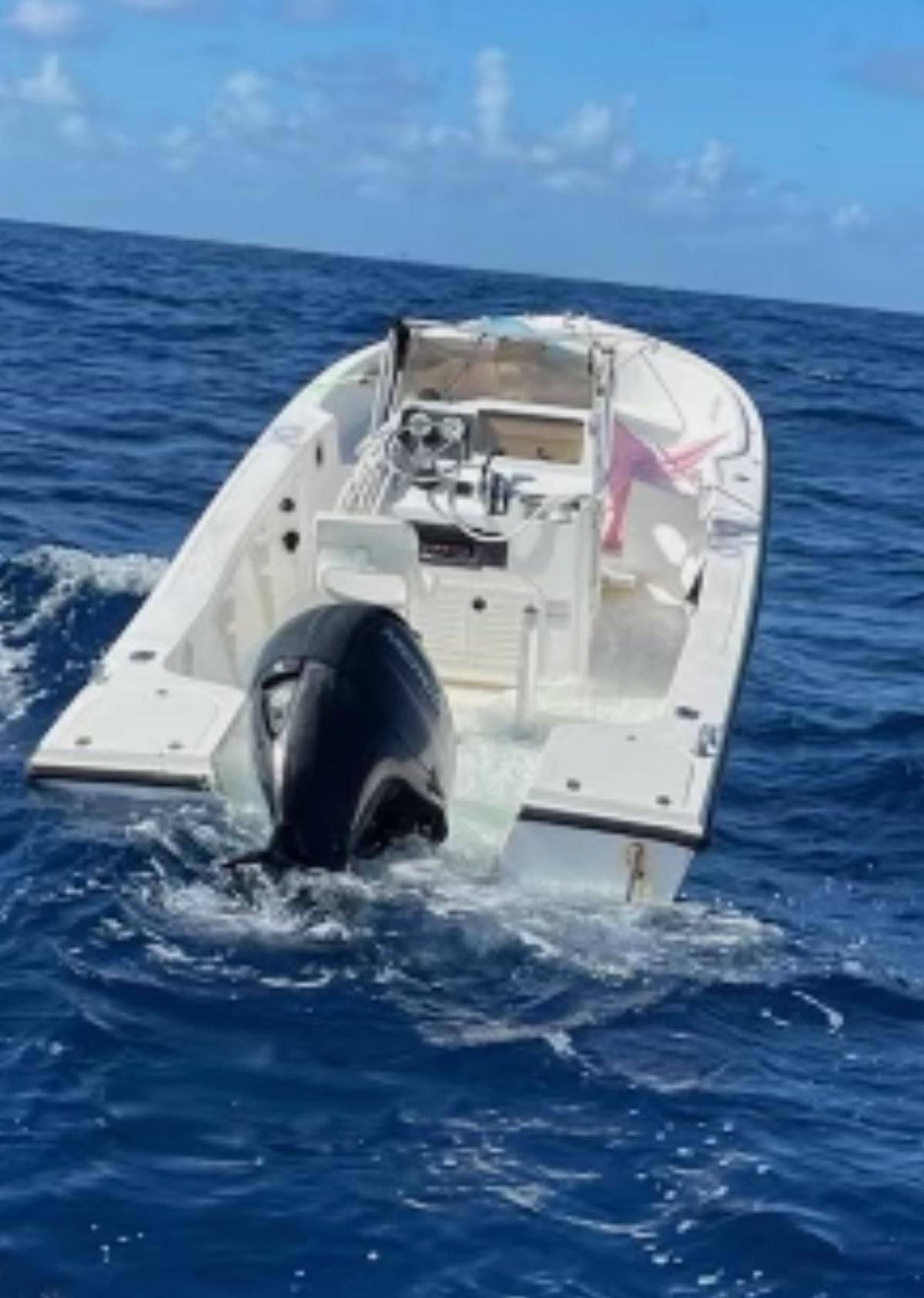 A center console boat drifts off Palm Beach that federal authorities said was used in a migrant smuggling attempt the weekend of Oct. 30, 2022.