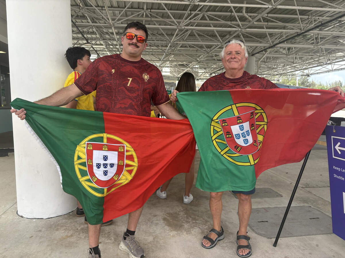 Philip Costa, 41, and Manny Costa, 75, a father and son from Central Florida awaiting a shuttle to watch Manny’s native Portugal take on Colombia.