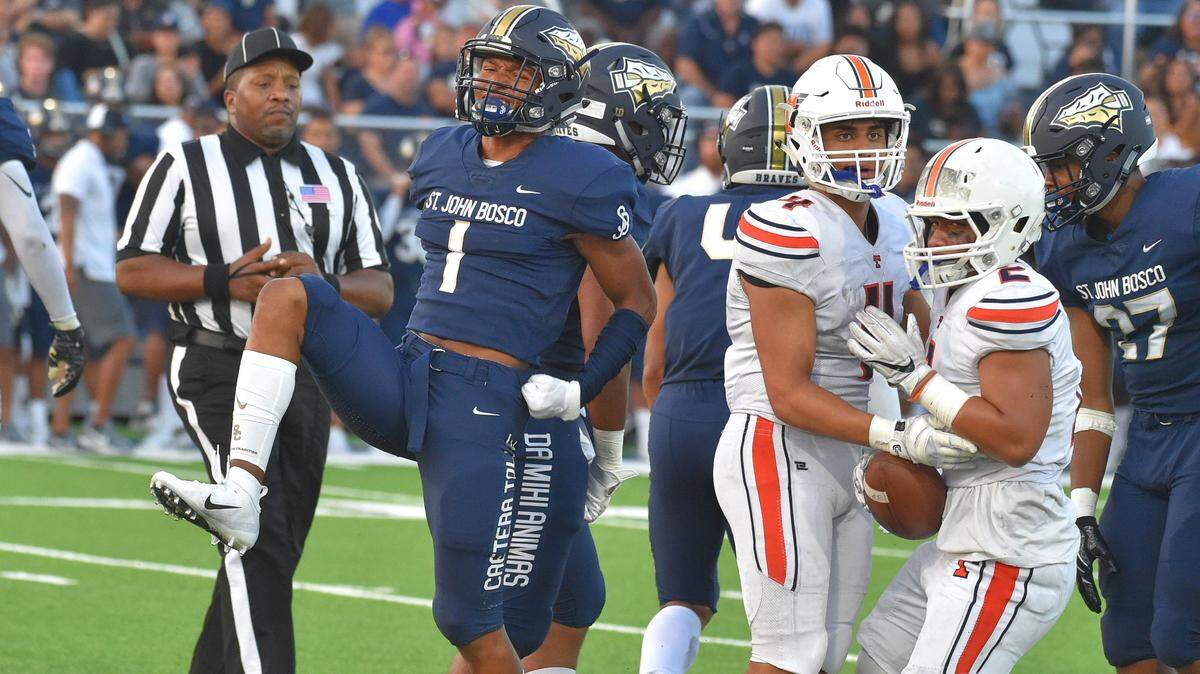 St. John Bosco’s Chris Steele (1) celebrates a tackle for a loss in Bellflower, Calif. on Friday, Aug. 17, 2018. St. John Bosco played their first game on campus since the 2014 season in their new $7.2 million stadium against Timpview of Provo, Utah.