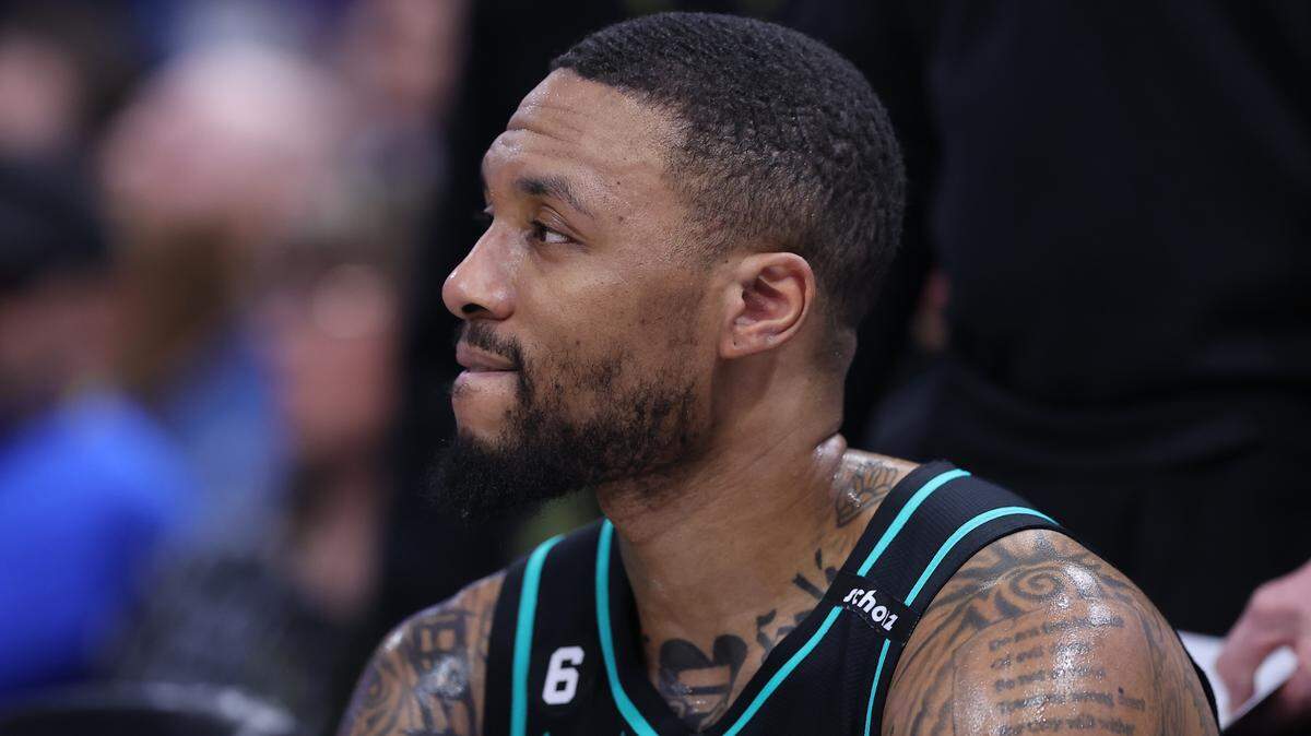 Portland Trail Blazers guard Damian Lillard (0) looks on during a time out against the Utah Jazz in the third quarter at Vivint Arena.
