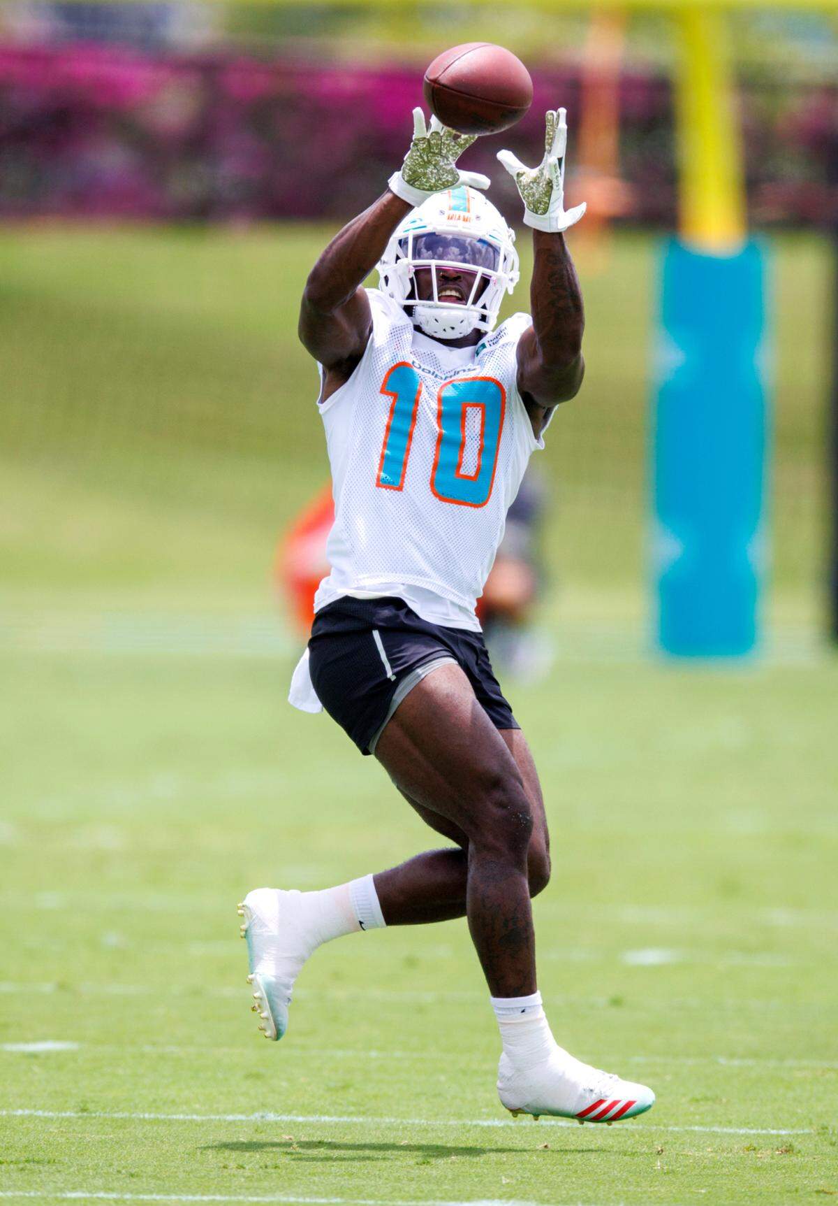 Miami Dolphins wide receiver Tyreek Hill catches a pass during the NFL football team’s organized team activities at Baptist Health Training Complex in Hard Rock Stadium on Tuesday, May 24, 2022 in Miami Gardens, Florida, in preparation for their 2022-23 NFL season.