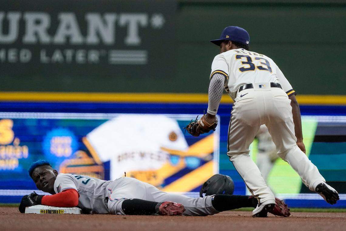 Miami Marlins’ Jazz Chisholm Jr. stals second with Milwaukee Brewers’ Steve Karsay covering during the first inning of a baseball game Tuesday, April 27, 2021, in Milwaukee.