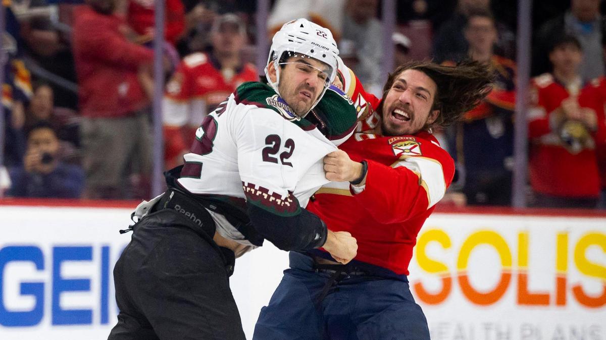 Florida Panthers left wing Ryan Lomberg (94) hits Arizona Coyotes center Jack McBain (22) during the first few seconds of the game on Wednesday, Jan. 24, 2024, at Amerant Bank Arena in Sunrise, Fla.