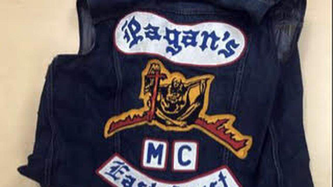A Pagan’s motorcycle gang vest is displayed on a table by the Monroe County Sheriff’s Office after a previous arrest of a suspected member in the Florida Keys.