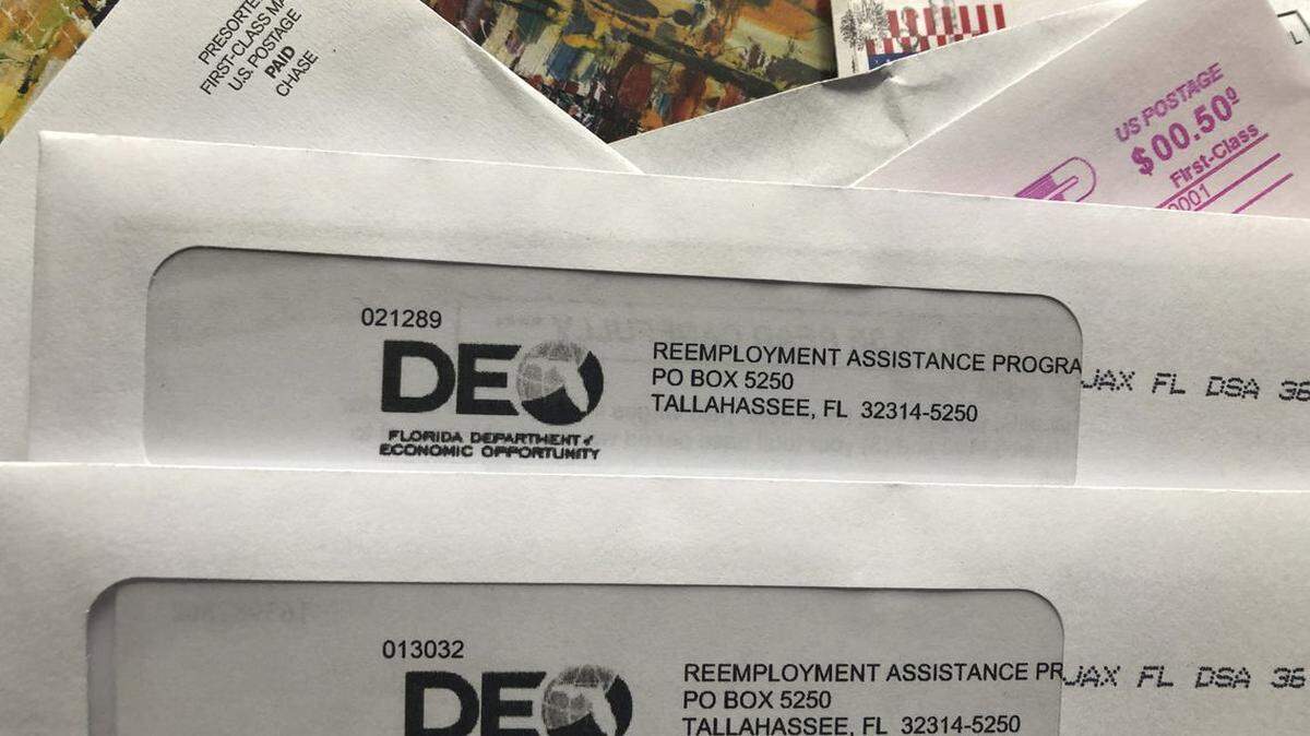 Envelopes from the Florida Department of Economic Opportunity Reemployment Assistance Program are shown, Thursday, Nov. 5, 2020, in Surfside, Florida.