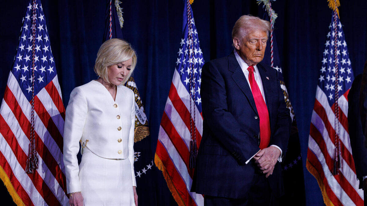 President Donald Trump joins Paula White at the National Prayer Breakfast in Washington last February.