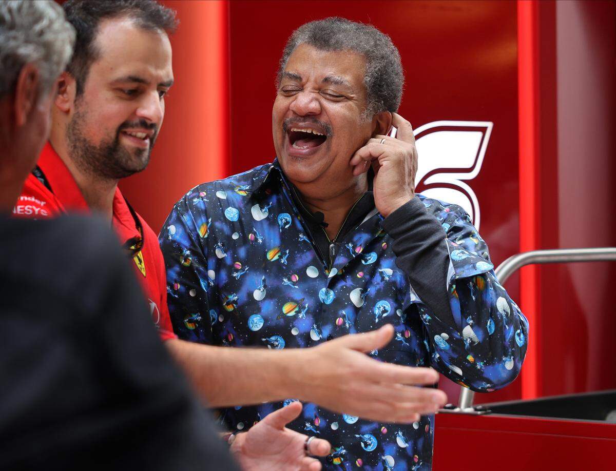 Physicist Neil Degrassi Tyson shares a laugh while taking the science of Formula 1 racing with Ferrari’s engineer at the Paddock prior to the Sprint Race on the second day of the Formula One Miami Grand Prix at the Miami International Autodrome on Saturday, May 2, 2026, in Miami Gardens, Fla.