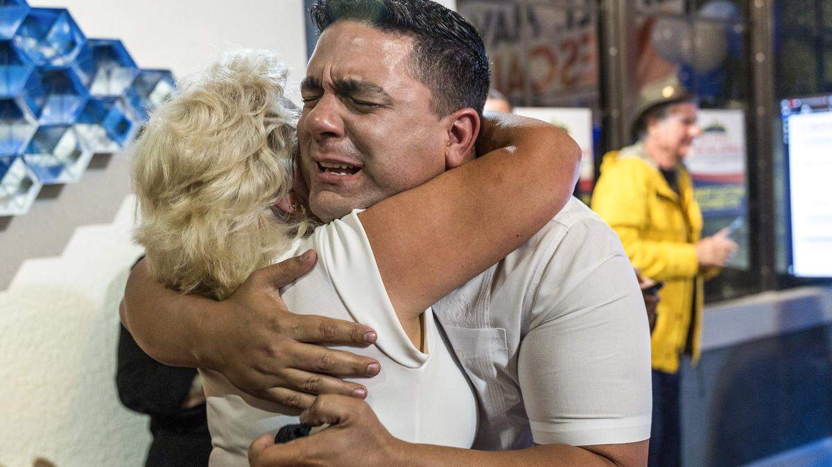 Mayra Guerra hugs her son Rolando Escalona, a political newcomer, after he defeated former two-term Commissioner Frank Carollo during the Miami District 3 runoff election on Tuesday, Dec. 9, 2025.