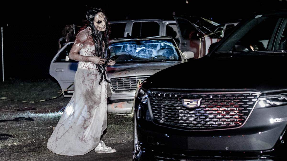 We don’t know who or what this terrifying, evil ghoul is, but we would really appreciate it if she would get away from our car.