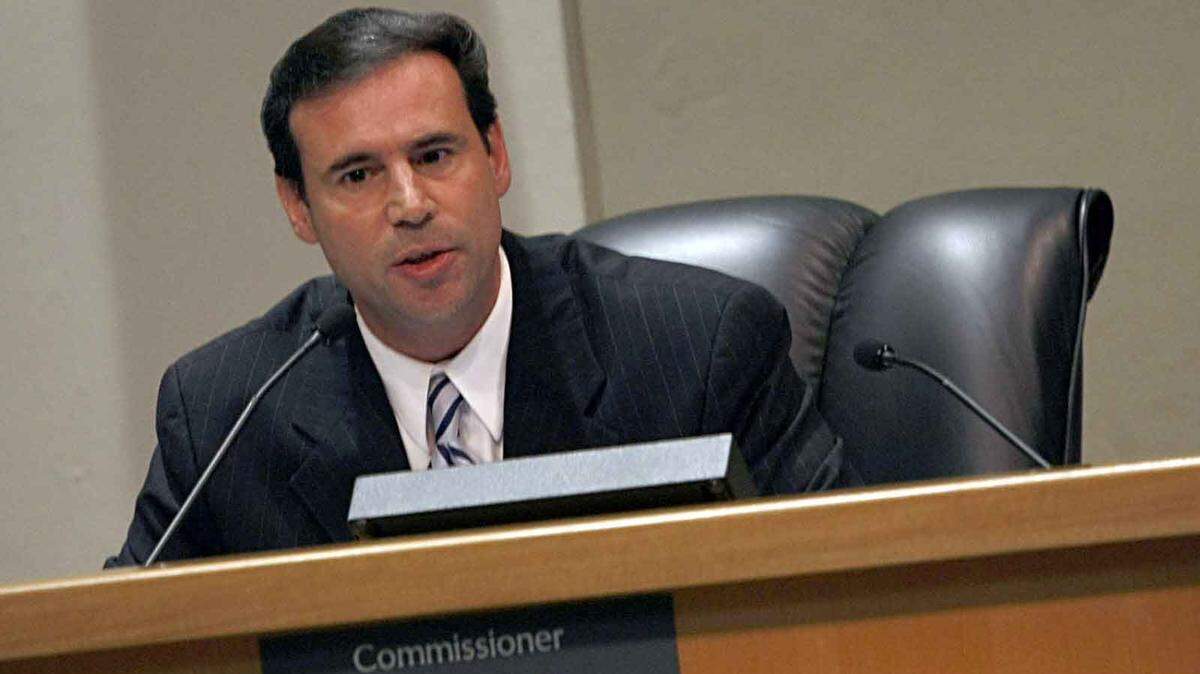 In a November 2009 file photo, Frank Carollo speaks during a public hearing at Miami City Hall.