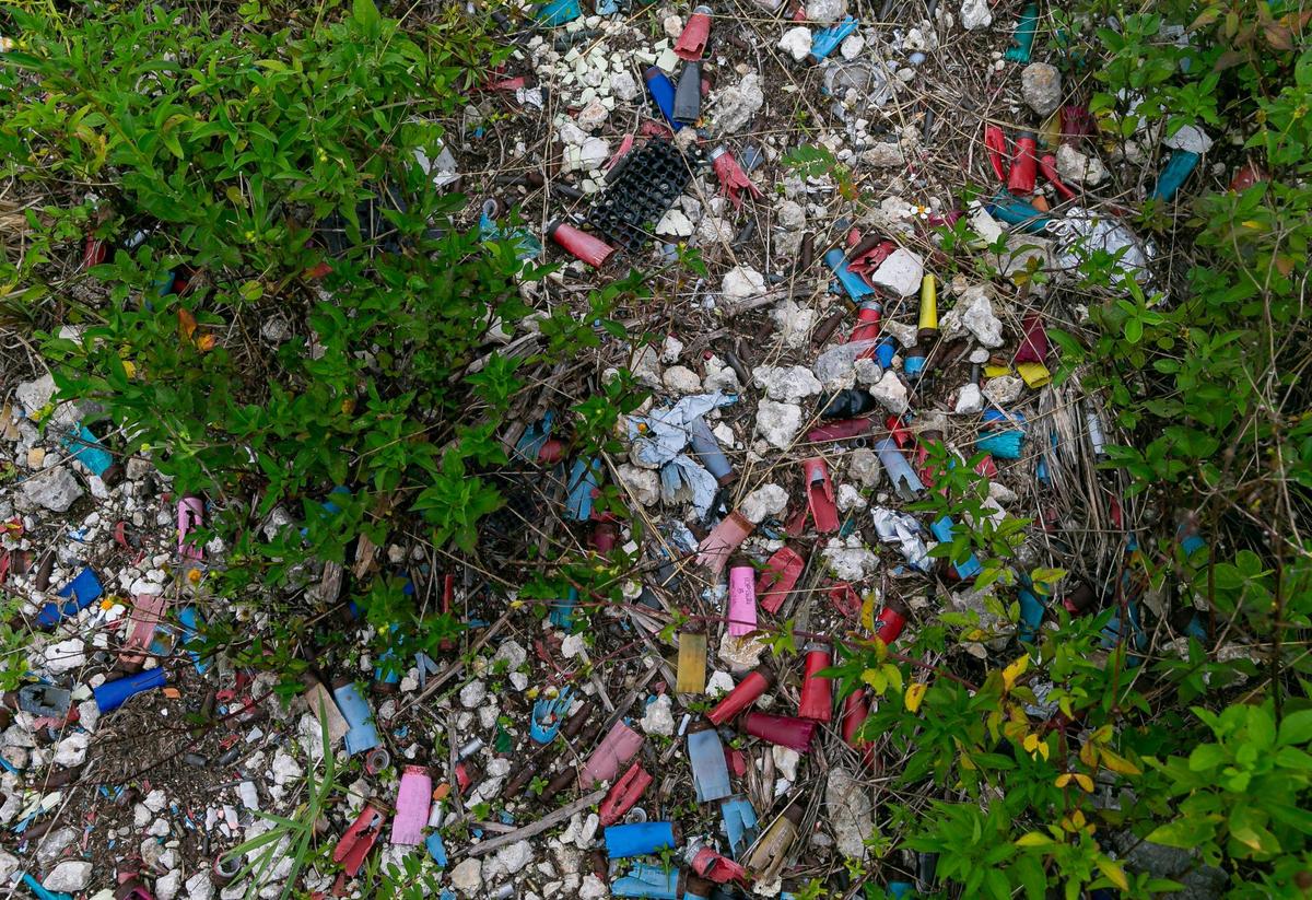 The scene along the canal, where a sea of spent shells crunches underfoot.