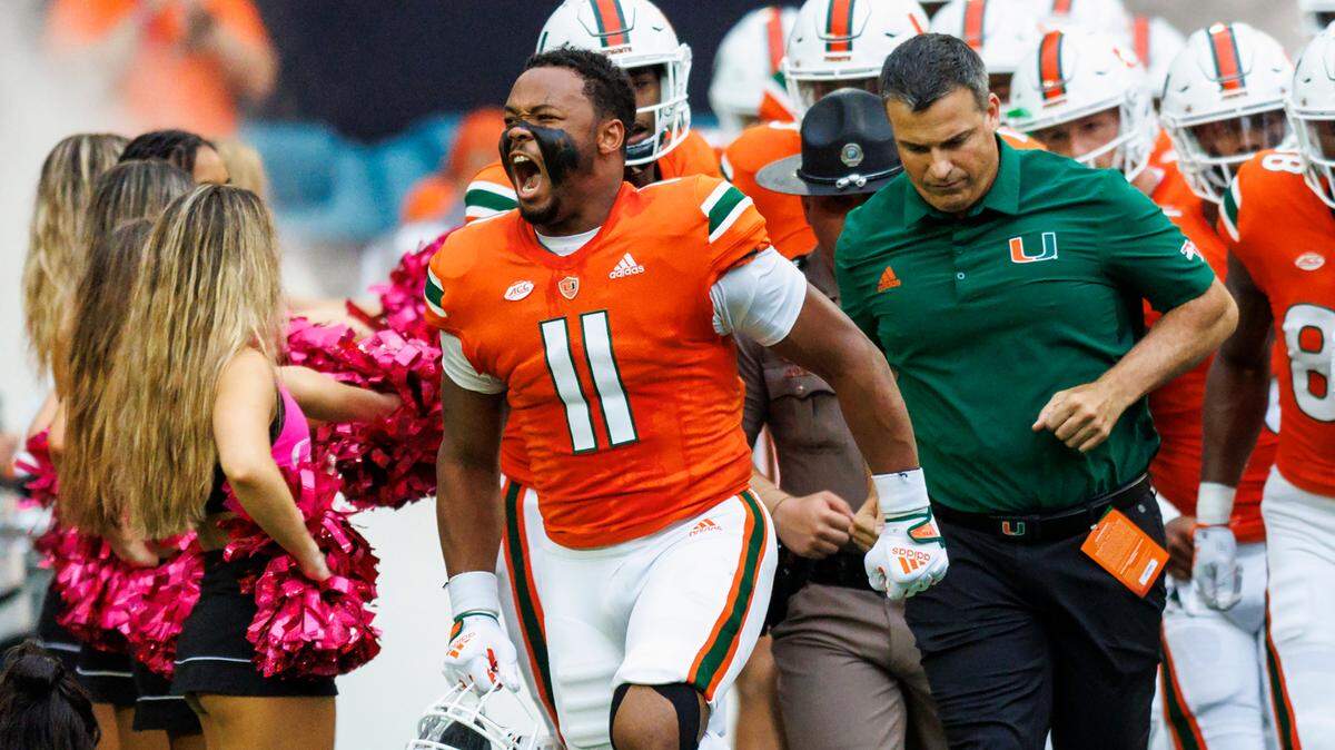 Miami Hurricanes linebacker Corey Flagg Jr. (11) takes the field with teammates before the start of an ACC conference football game against North Carolina Tar Heels at Hard Rock Stadium on Saturday, October 8, 2022 in Miami Gardens, Florida..