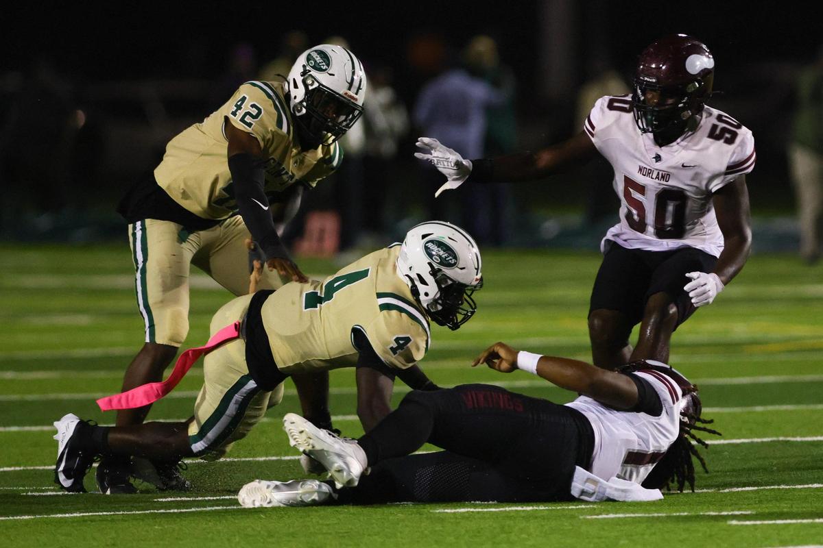 Central Rockets inside linebacker Ezekiel Marcelin (4) sacked Norland Vikings quarterback Ennio Yapoor (17) during the first quarter of a high school football game at Traz Powell stadium in Miami, Florida, Friday, October 18, 2024.