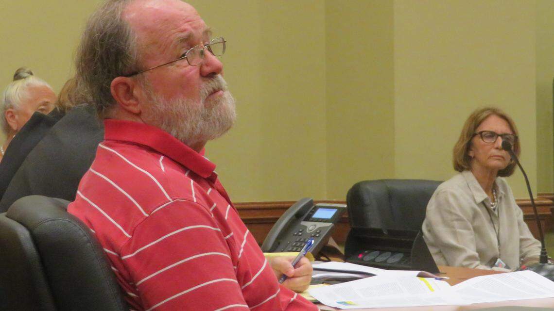 Sloan Bashinsky, left, sits in court Monday, June 25, 2018, along with other Key West mayoral candidates including Teri Johnston, right.