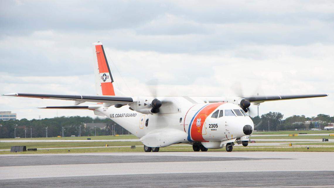 Florida Gov. Ron DeSantis arrives aboard a U.S. Coast Guard airplane for a press conference at Pensacola International Airport in 2020.