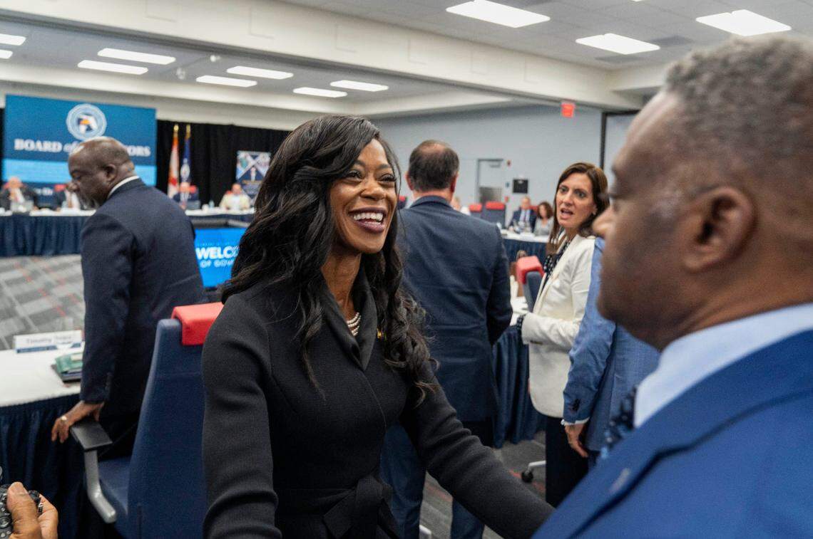 Marva Johnson smiles at FAMU trustee board vice chair Deveron Gibbons she was confirmed as the new Florida A&M University president during the Florida Board of Governors meeting at Florida Atlantic University on June 18, 2025 in Boca Raton, Florida.