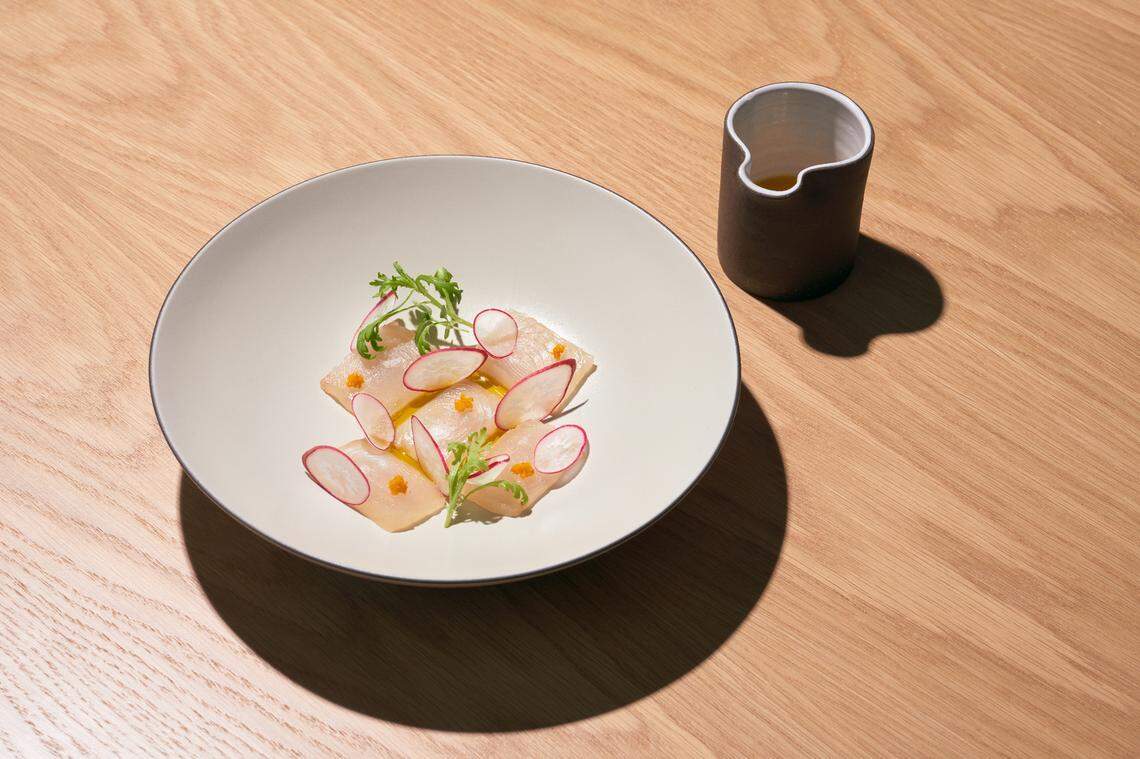 Line caught sashimi with sour orange is one of the appetizers at MaryGold’s restaurant in Wynwood.