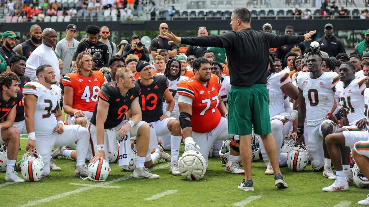 Miami Hurricanes head coach Mario Cristobal speaks to the team after the University of Miami spring game at DRV PNK Stadium in Fort Lauderdale, Florida on Saturday, April 16, 2022.