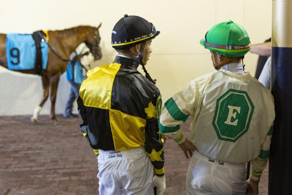 Jose Ortiz, left, and his brother Irad Ortiz Jr. get ready to compete in a horse race at Gulfstream Park in Hallandale Beach, Florida, on Wednesday, Jan. 9, 2019. The Ortiz brothers are regarded as two of the best jockeys in the nation.