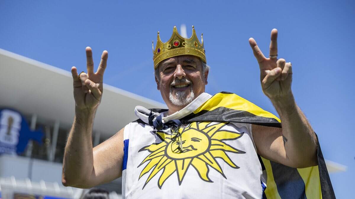 Julio Mas, an Uruguay fan, reacts as he arrives to Hard Rock Stadium before his team's World Cup Group H soccer match against Cape Verde on Sunday, June 21, 2026, in Miami Gardens, Fla.