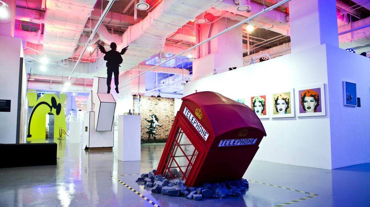 “Death of a Phone Booth” is one of the pieces on display at “The Art of Banksy: Without Limits.”