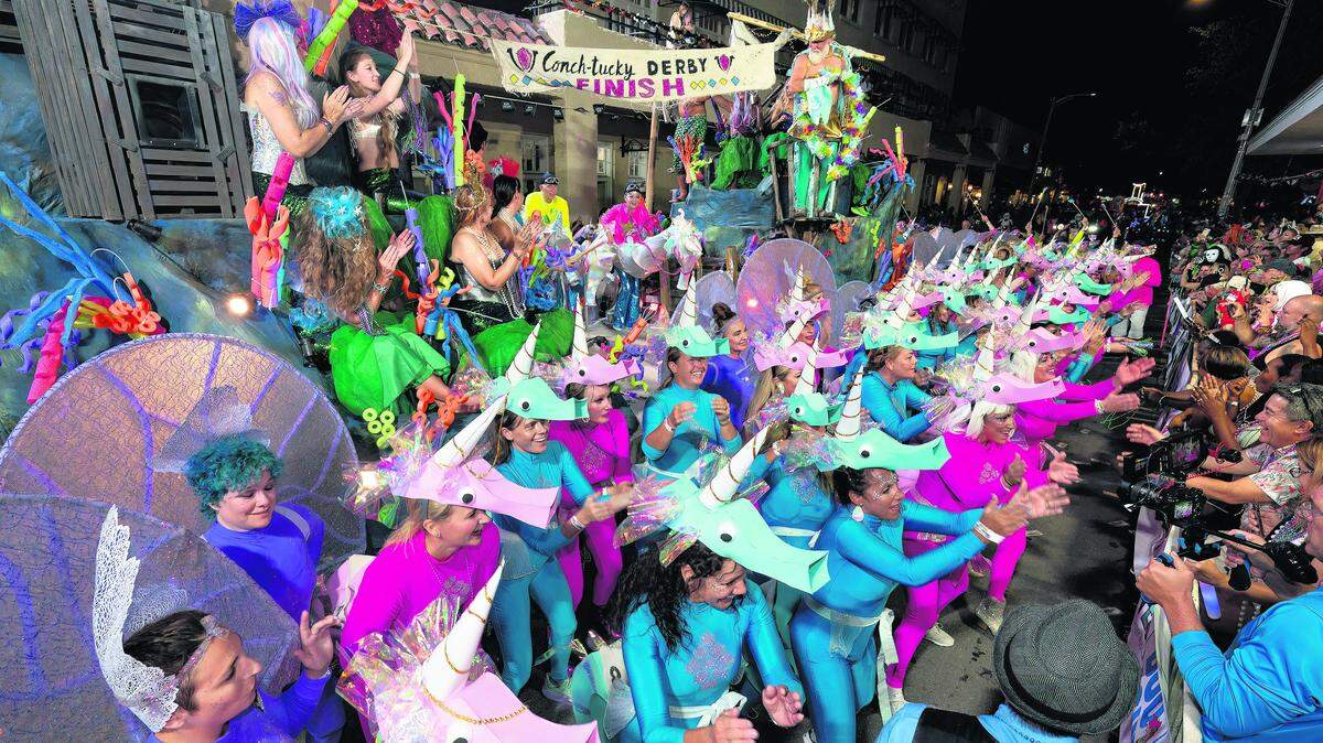 A group depicting an offbeat "Conch-tucky Derby" for unicorns performs on Duval Street during the Fantasy Fest Parade in Key West, Fla. The elaborate procession of floats and costumed marchers will return Saturday, Oct. 25, 2025, as the highlight of the 10-day Fantasy Fest celebration, themed "Bedtime Stories and Magical Monsters," running Oct. 17-26. FOR EDITORIAL USE ONLY (Andy Newman/Florida Keys News Bureau)