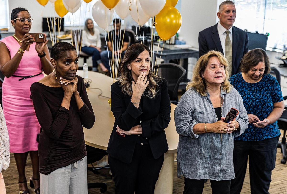 Monica Richardson, back left, vice president of local news, joined Editorial Board members, left to right, Nancy Ancrum, Amy Driscoll and Luisa Yanez as Pulitzer Prize winners were announced on May 8, 2023.