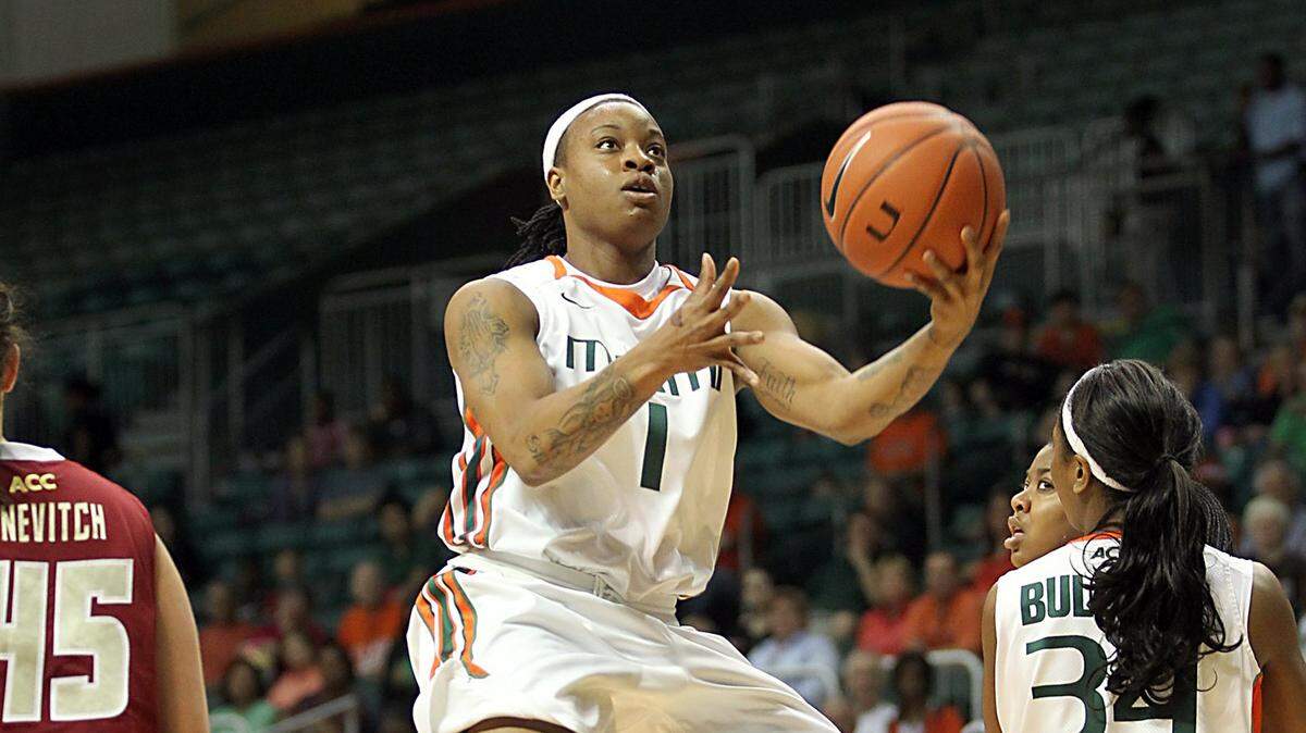 Riquna Williams drives to the hoop in a 2012 game when she was a player at the University of Miami.