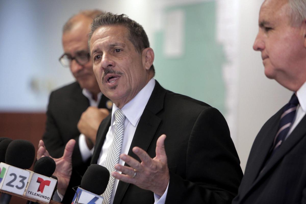 Miami-Dade Commissioner Jose “Pepe” Díaz, center, answers questions from reporters during an Aug. 23, 2018, press conference in Doral Thursday afternoon. He’s flanked by commission Chairman Esteban “Steve” Bovo, left, and County  Mayor Carlos Gimenez. Both have endorsed Diaz in the Aug. 28 primary for the District 12 seat.